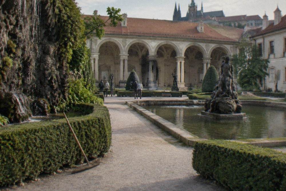 Quiet baroque garden with clipped hedges, statuary and a fountain in the heart of the Lesser Town