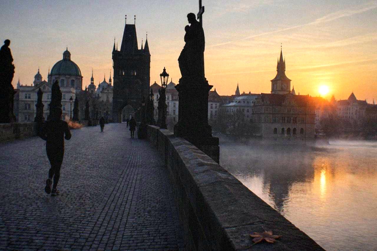 Charles Bridge stretching across the Vltava with towers and statues along its sides