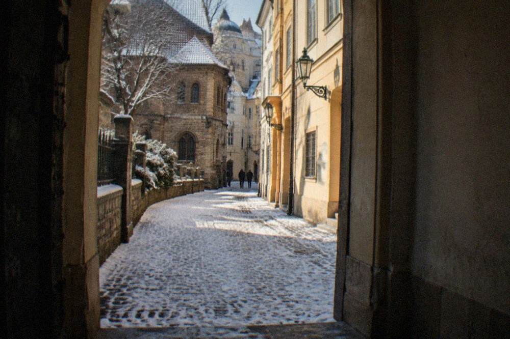 Narrow historic street in Josefov with old buildings on both sides