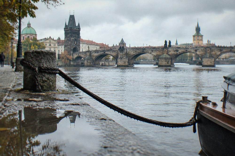 Charles Bridge and the Vltava river seen from a free riverside embankment in Prague