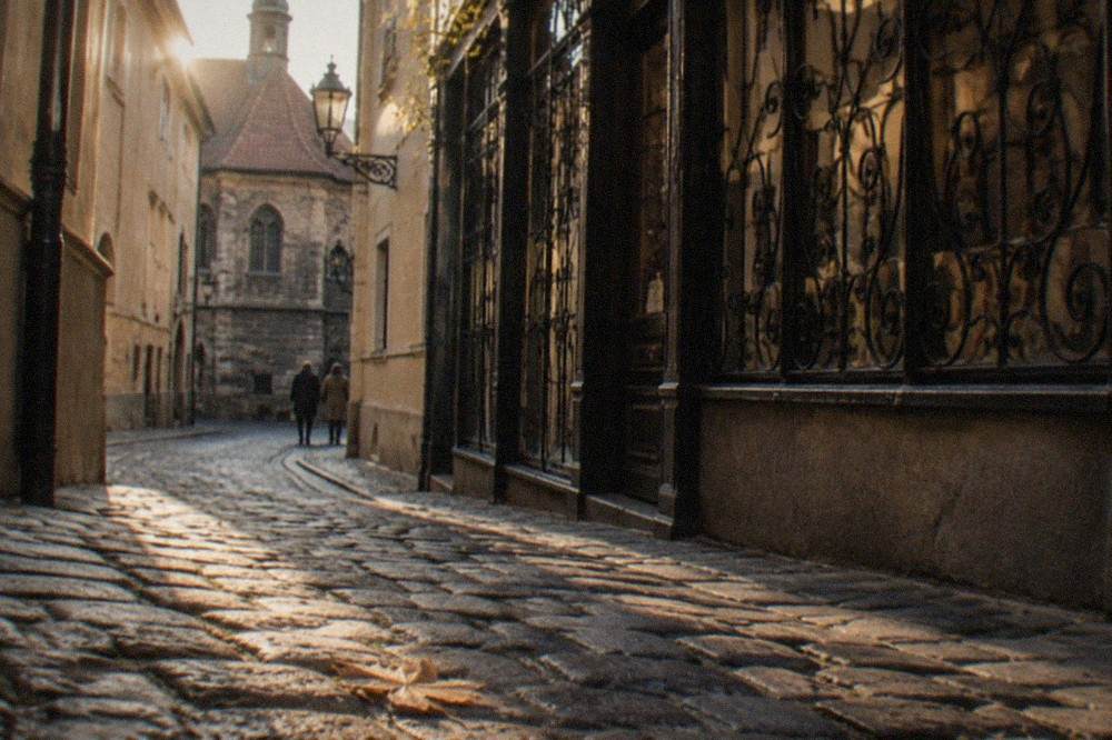Narrow cobblestone lane in Josefov with historic facades