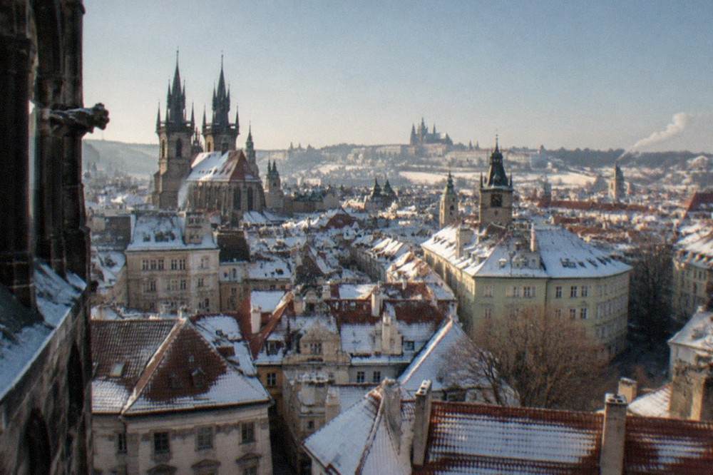 Snow-covered rooftops of the Old Town seen from a high vantage point on a clear winter morning