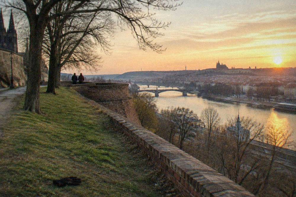 View from the Vyšehrad ramparts over the Vltava river and distant Prague rooftops