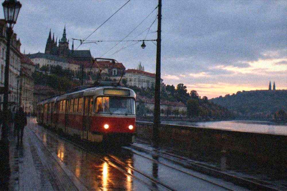 Prague tram travelling along a street with the Vysehrad district beyond
